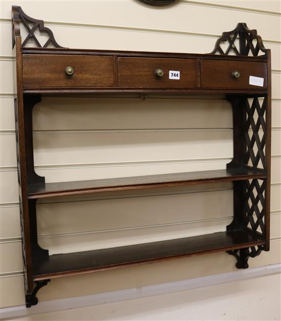 A mahogany wall shelf W.74cm